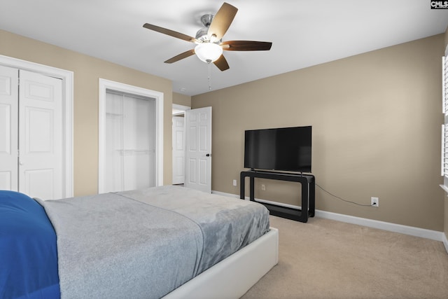 345 Amstar Rd, Columbia, SC 29212 - bedroom with multiple closets, baseboards, light carpet, and a ceiling fan