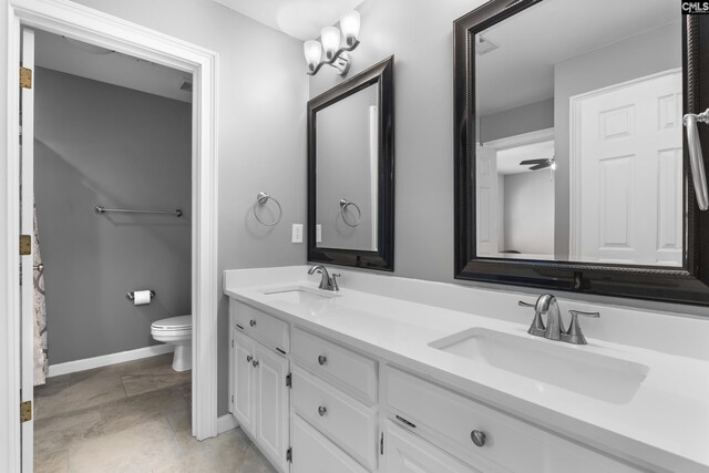 345 Amstar Rd, Columbia, SC 29212 - full bath featuring baseboards, double vanity, a sink, and toilet