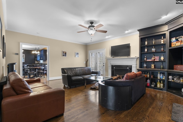 345 Amstar Rd, Columbia, SC 29212 - living room with dark wood finished floors, crown molding, ceiling fan with notable chandelier, and a fireplace