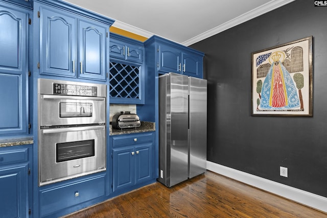 345 Amstar Rd, Columbia, SC 29212 - kitchen with appliances with stainless steel finishes, blue cabinetry, dark wood-type flooring, ornamental molding, and dark stone countertops