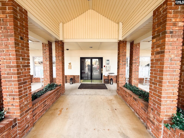 property entrance featuring brick siding