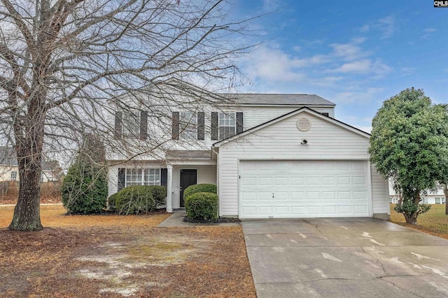 traditional-style home with an attached garage and concrete driveway