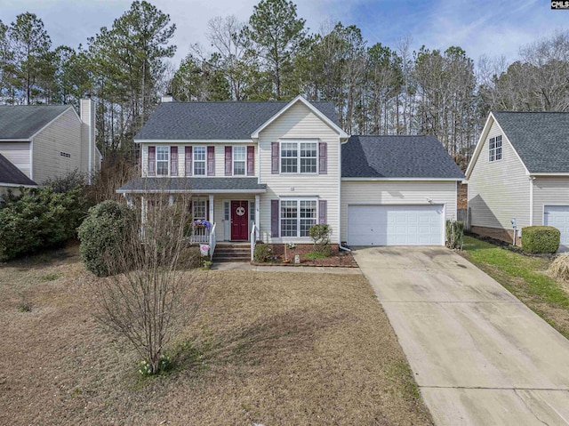 view of front of property featuring a shingled roof, an attached garage, concrete driveway, and a front yard