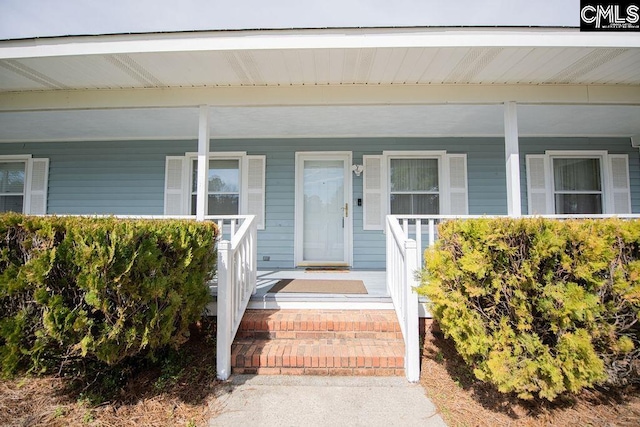 doorway to property featuring covered porch