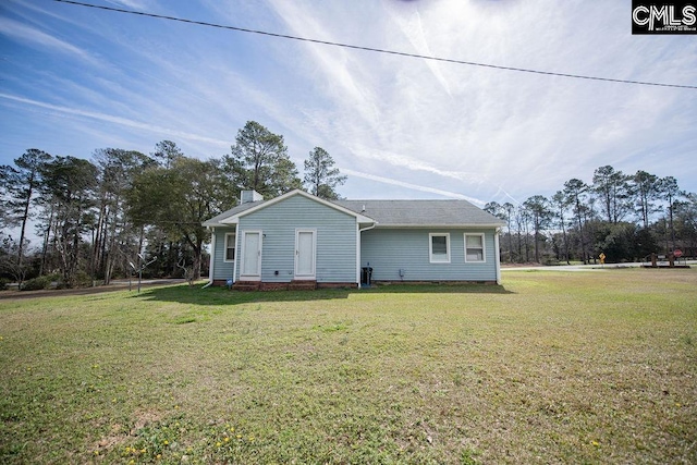 view of front of house with crawl space and a front lawn