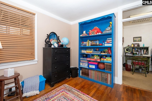 recreation room with dark wood-type flooring