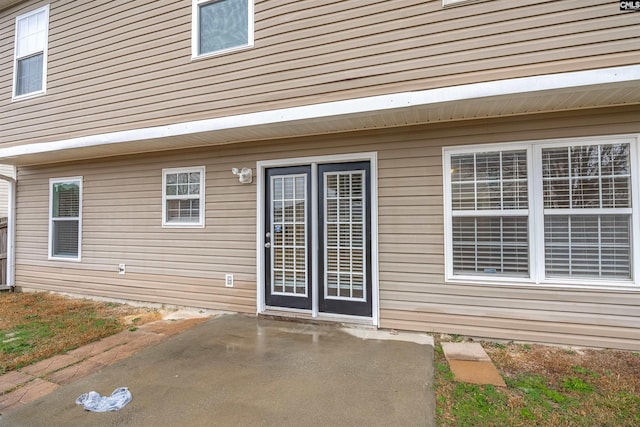 property entrance with a patio