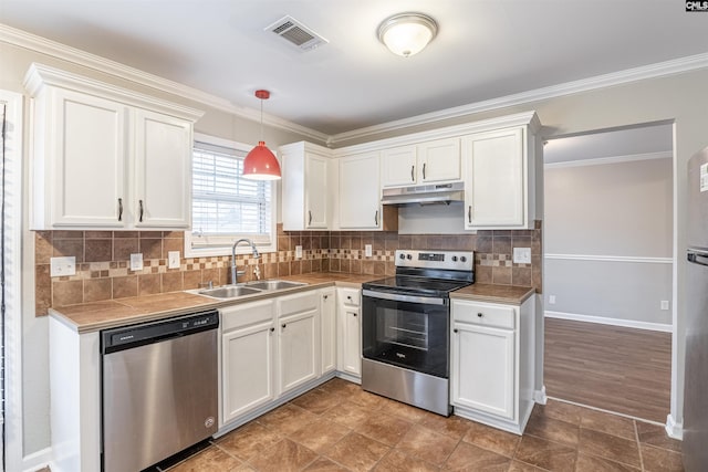 kitchen featuring stainless steel appliances, white cabinetry, a sink, and under cabinet range hood