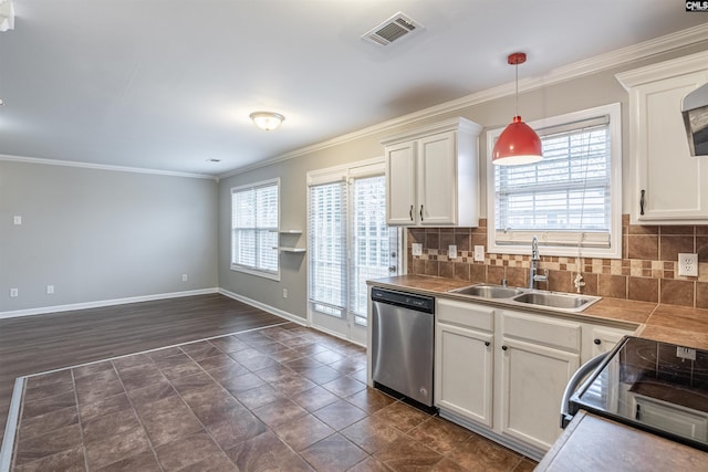 kitchen featuring pendant lighting, visible vents, stainless steel dishwasher, white cabinetry, and a sink