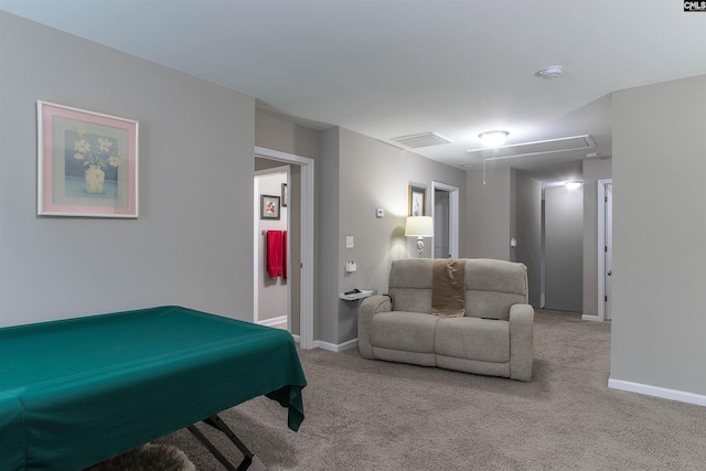 rec room with attic access, light colored carpet, visible vents, and baseboards