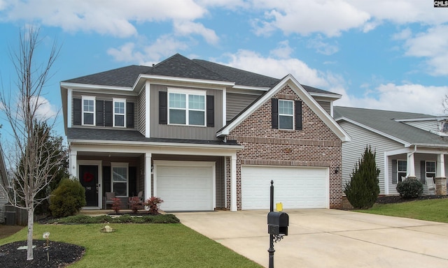 view of front of property with concrete driveway, brick siding, an attached garage, and a front lawn