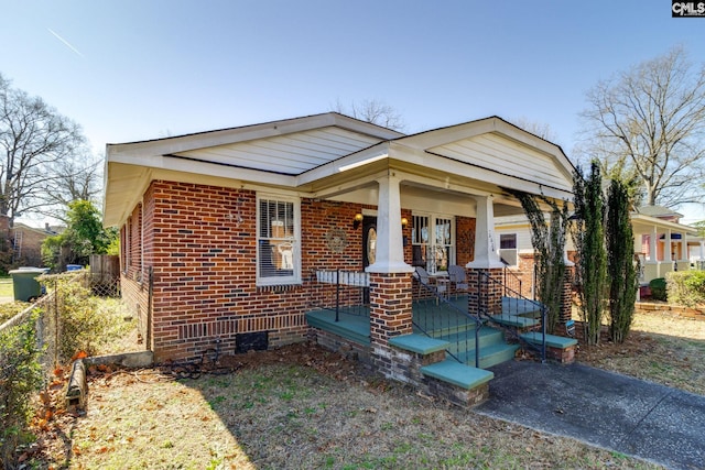 view of front of property featuring a porch and brick siding