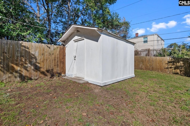 view of shed featuring a fenced backyard