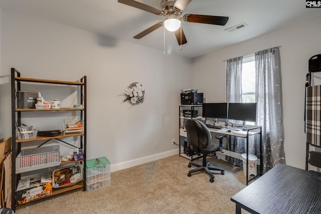 home office with carpet, visible vents, ceiling fan, and baseboards