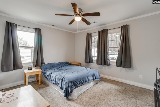 bedroom with baseboards, multiple windows, and crown molding