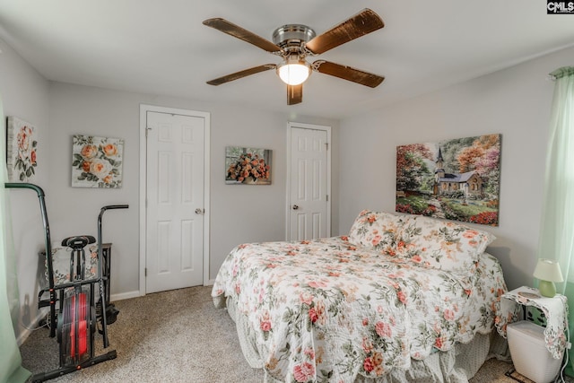 bedroom with ceiling fan, baseboards, and light colored carpet