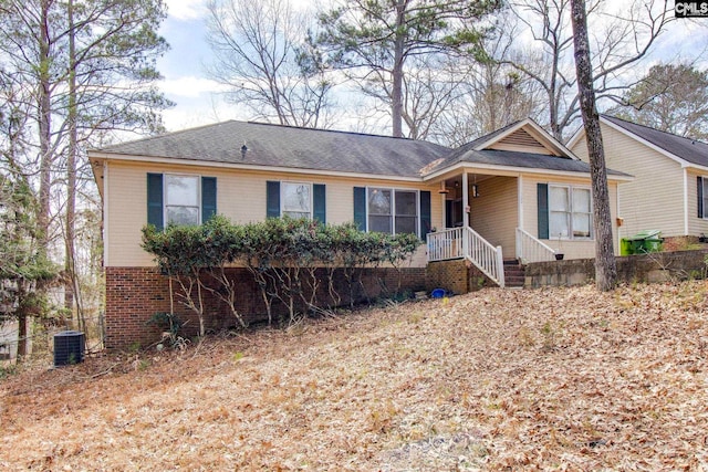 ranch-style home with brick siding and central air condition unit