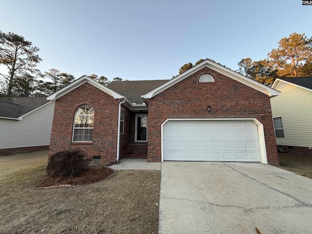 ranch-style house with a garage, crawl space, brick siding, and driveway