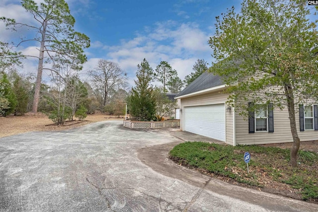 view of property exterior with driveway