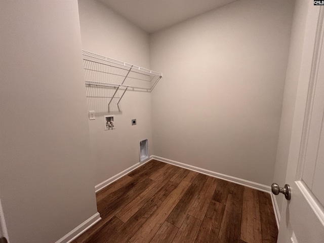 clothes washing area featuring laundry area, baseboards, dark wood-type flooring, hookup for an electric dryer, and washer hookup