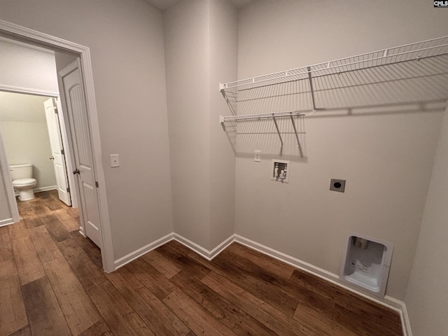 clothes washing area featuring hookup for a washing machine, hookup for an electric dryer, laundry area, dark wood-type flooring, and baseboards