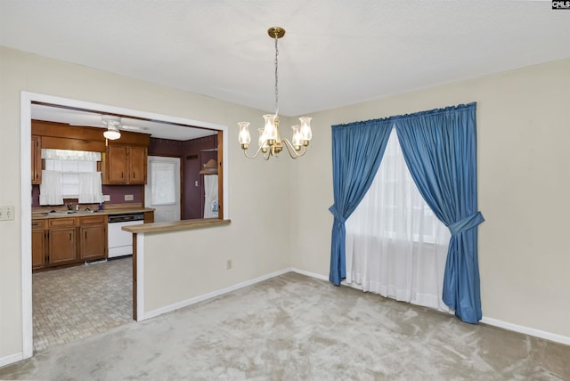 dining space with baseboards, an inviting chandelier, and light colored carpet