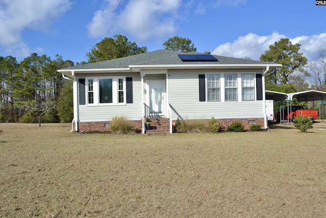 bungalow with entry steps, crawl space, a detached carport, and a front yard