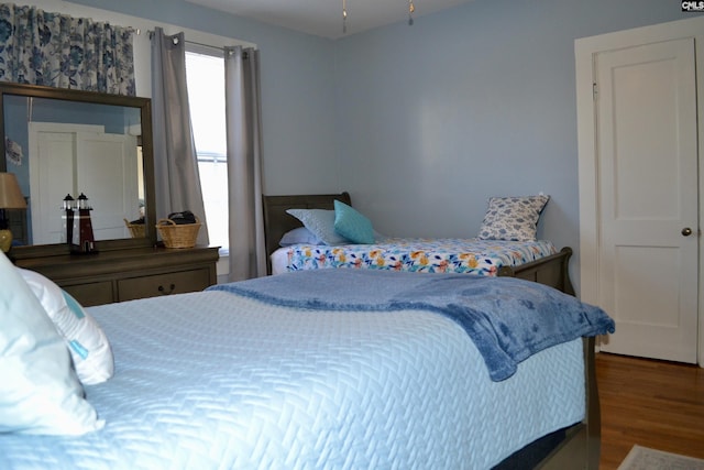 bedroom featuring wood finished floors