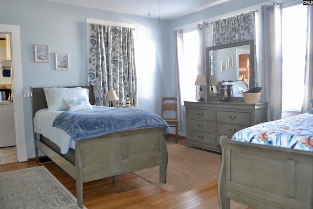 bedroom with wood finished floors