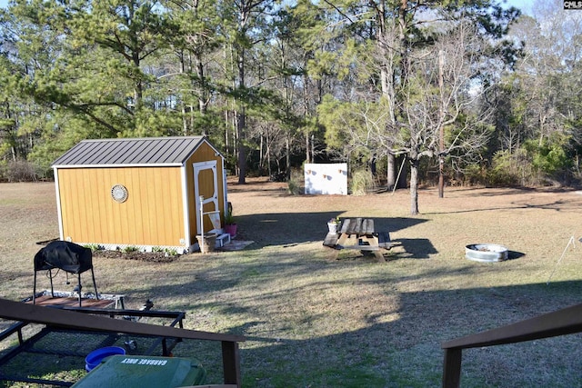 view of yard with a shed and an outdoor structure