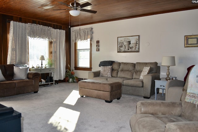 living area featuring wood ceiling, light carpet, and ceiling fan