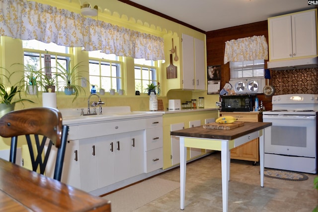 kitchen with light countertops, white range with electric cooktop, under cabinet range hood, and white cabinets