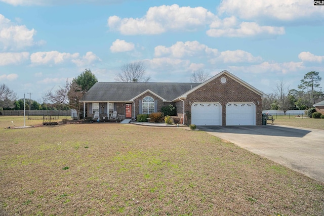 single story home with a garage, brick siding, fence, and a front yard