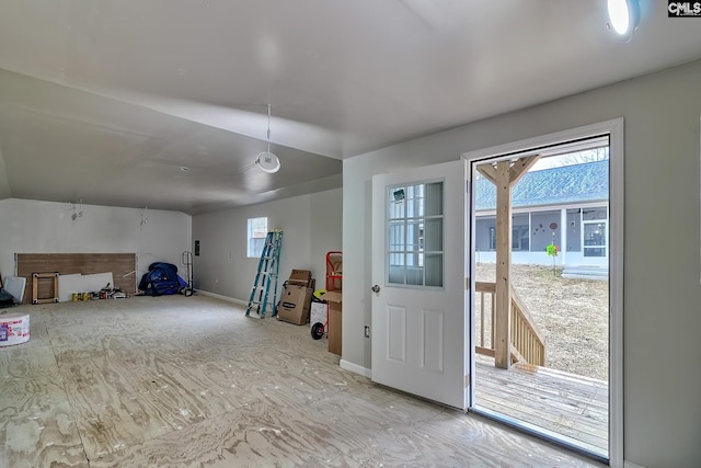 interior space featuring a healthy amount of sunlight and baseboards