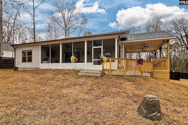 back of house with a sunroom, ceiling fan, and a deck