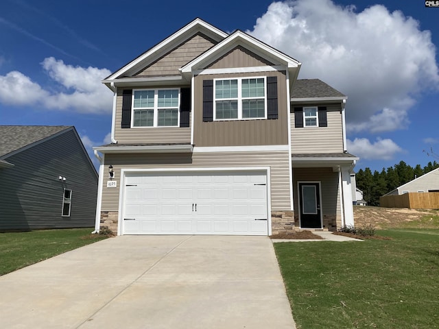 craftsman inspired home with a front lawn, stone siding, driveway, and an attached garage