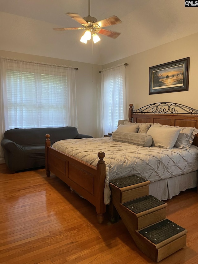 bedroom with ceiling fan and wood finished floors