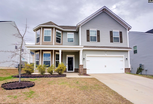 view of front of property with brick siding, a porch, concrete driveway, a garage, and a front lawn