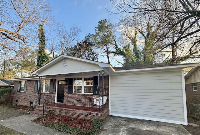 view of front of home featuring a porch, crawl space, and brick siding