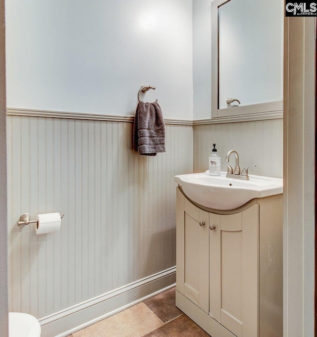 bathroom with wainscoting and vanity