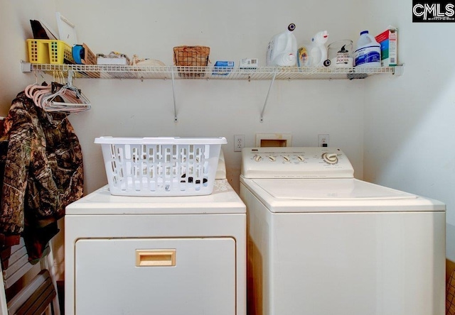 laundry room with laundry area and separate washer and dryer