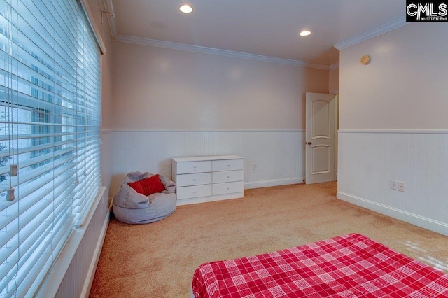 bedroom with light carpet, a wainscoted wall, crown molding, and recessed lighting