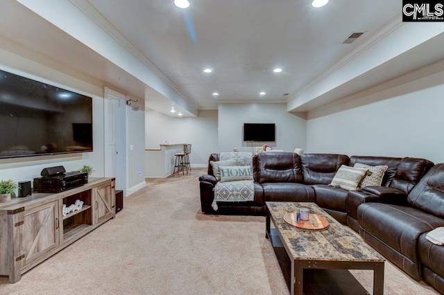 living area with ornamental molding, recessed lighting, visible vents, and light colored carpet