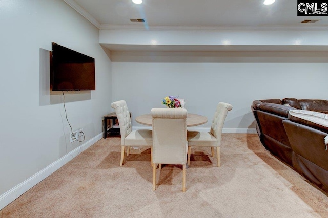 unfurnished dining area with light carpet, baseboards, visible vents, and crown molding