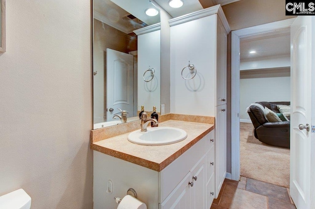 bathroom with vanity and toilet