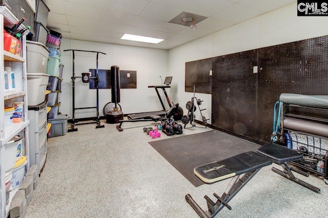 exercise room featuring a paneled ceiling