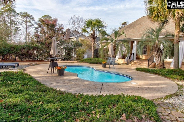 pool with a patio