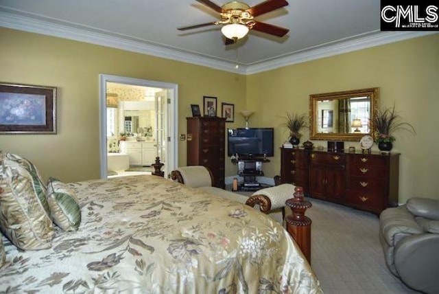 bedroom featuring ornamental molding, ensuite bathroom, and light colored carpet