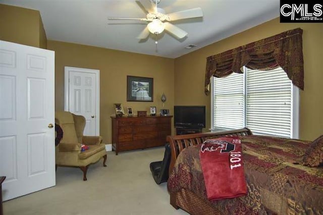 bedroom with light carpet and ceiling fan