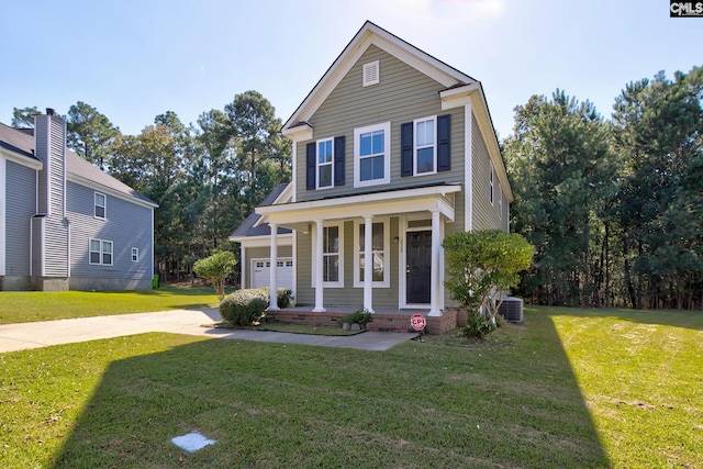 traditional-style home with central air condition unit, covered porch, a front lawn, and concrete driveway